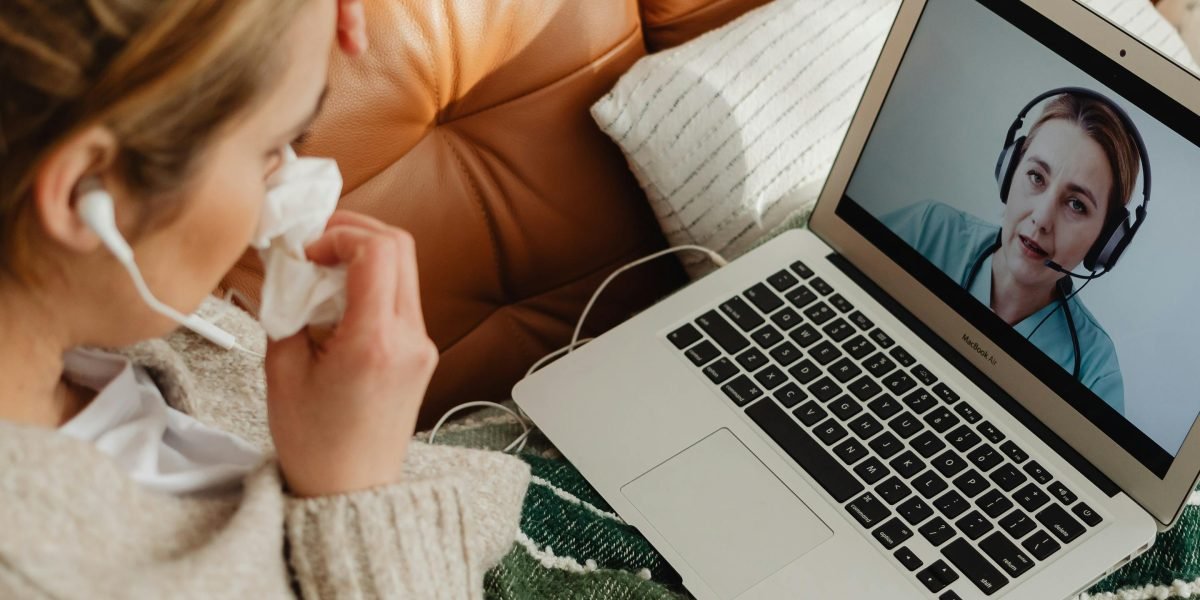 A person receiving a remote medical consultation, illustrating the role of AI in modern telemedicine platforms.