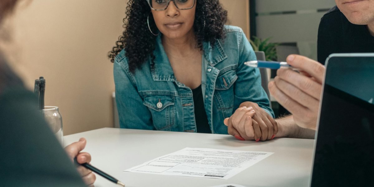 A legal professional or team meticulously reviewing complex documents related to AI regulations and compliance.