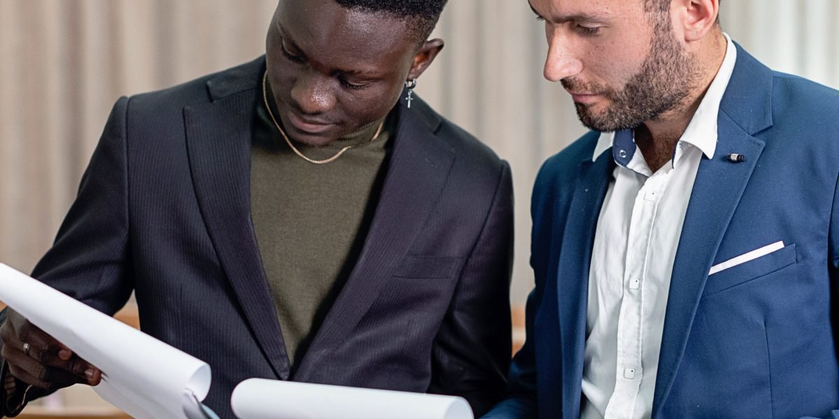 A focused legal team meticulously reviewing complex documents, symbolizing the need for accuracy and reliability in legal work.