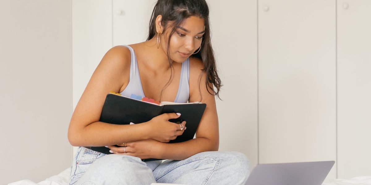 A person focused on reading a document, symbolizing continuous learning and staying informed on evolving terminology in tech policy.