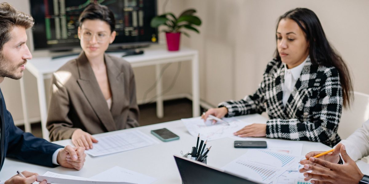 A team collaborating to understand and navigate complex AI regulations and compliance demands.