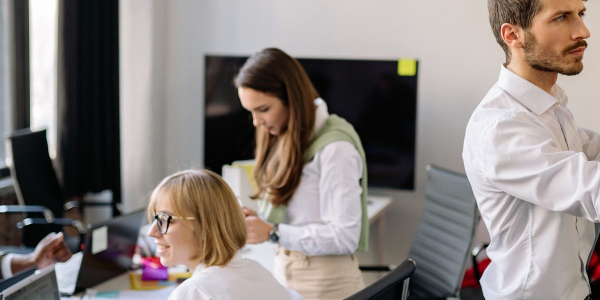 A team actively collaborating and mapping out a strategy on a whiteboard, reflecting the goal-oriented and adaptive nature central to AI agents.