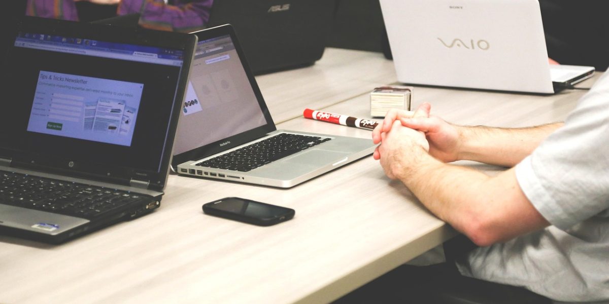 A confident professional engaging with a diverse team, illustrating the blend of regulatory insights and technological potential in AI investment.