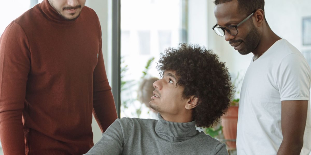 A diverse team collaborating virtually across different geographies, illustrating how companies adapt to global talent flows and immigration policies.