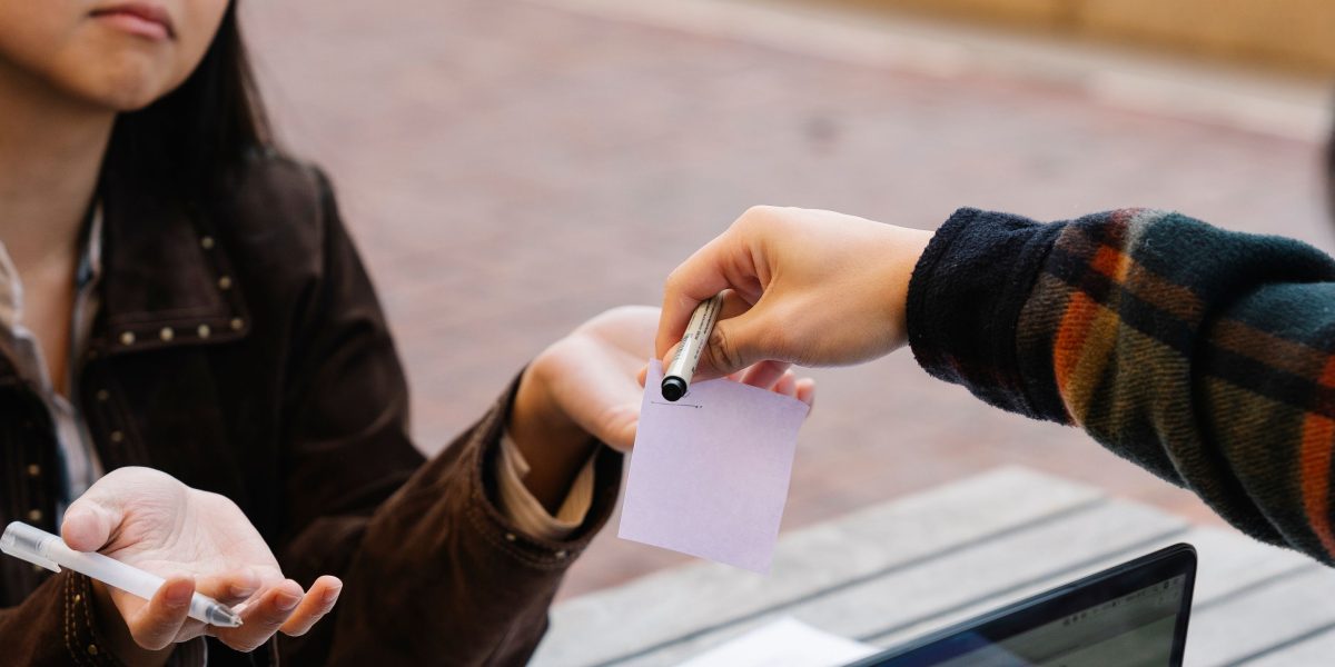 A student engages in a conversation with an academic advisor or teacher, potentially discussing a flagged assignment or academic integrity policies.