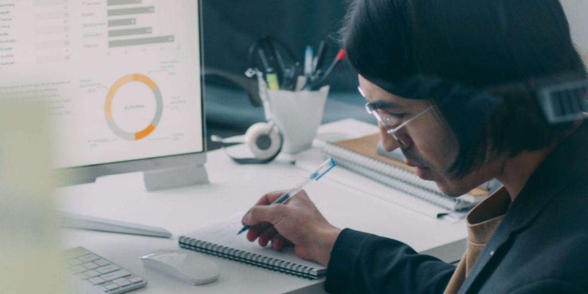 A professional confidently reviews data on a tablet, showcasing the improved decision-making capabilities that arise from enhanced tech literacy and data understanding.
