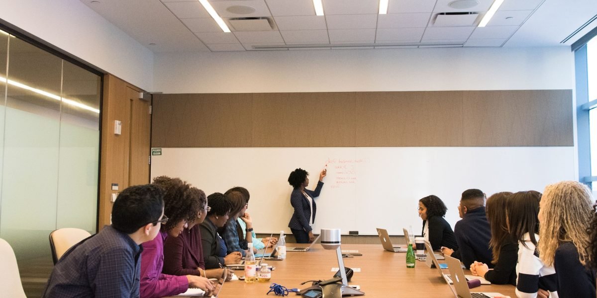 A corporate board meeting where members are engaged in a serious discussion about ethics and governance.