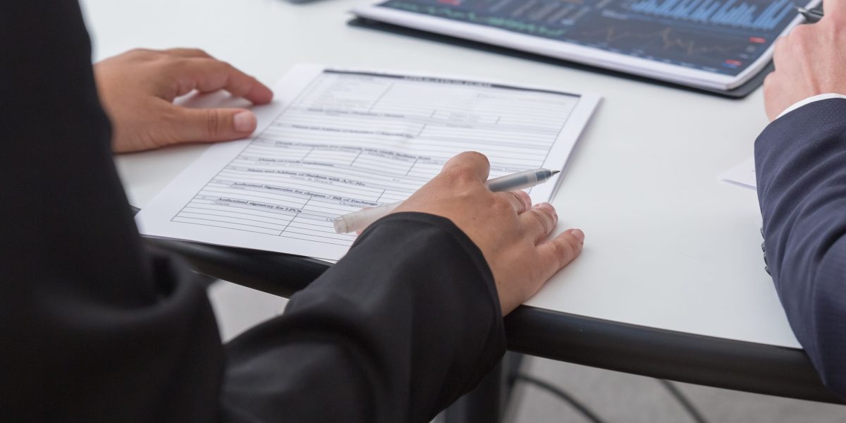 A professional analyzing charts and data, symbolizing the rigorous evaluation and understanding required for complex AI models.