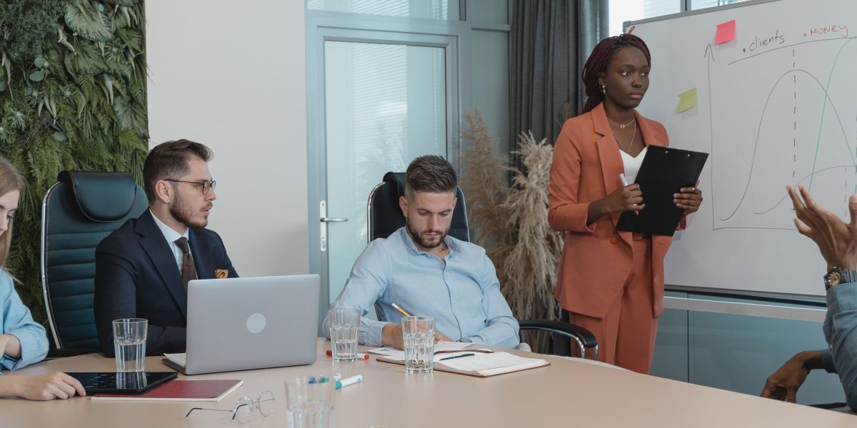 Researchers collaborating in a modern lab setting, brainstorming ideas for new AI breakthroughs.