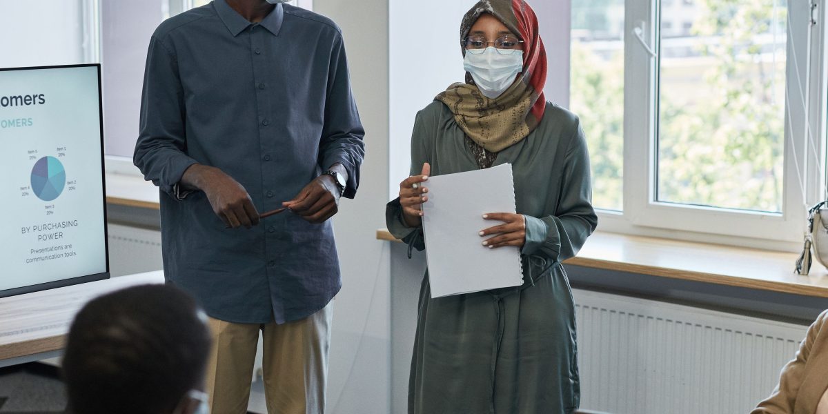 A team collaborating to present a new AI-powered product to stakeholders, emphasizing its unique value proposition.