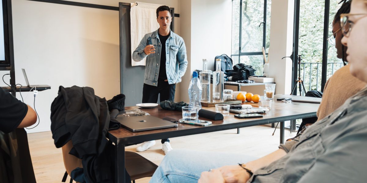 A creative team collaborating to ensure AI-generated content aligns with brand guidelines and visual standards.