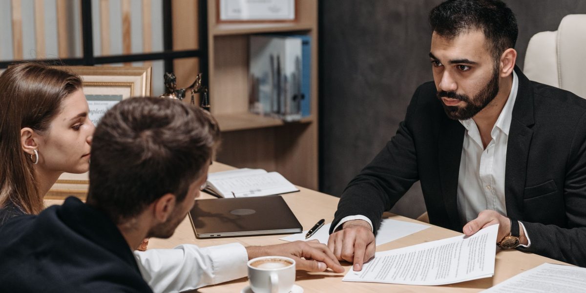 Professionals conducting a legal review, symbolizing the importance of compliance and ethical considerations in AI use.