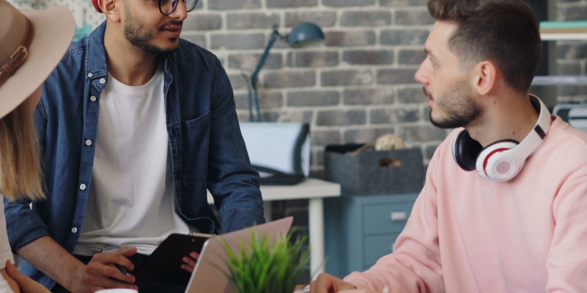A diverse team actively collaborating in a modern office, symbolizing the selection and application of different AI tools for specific tasks.
