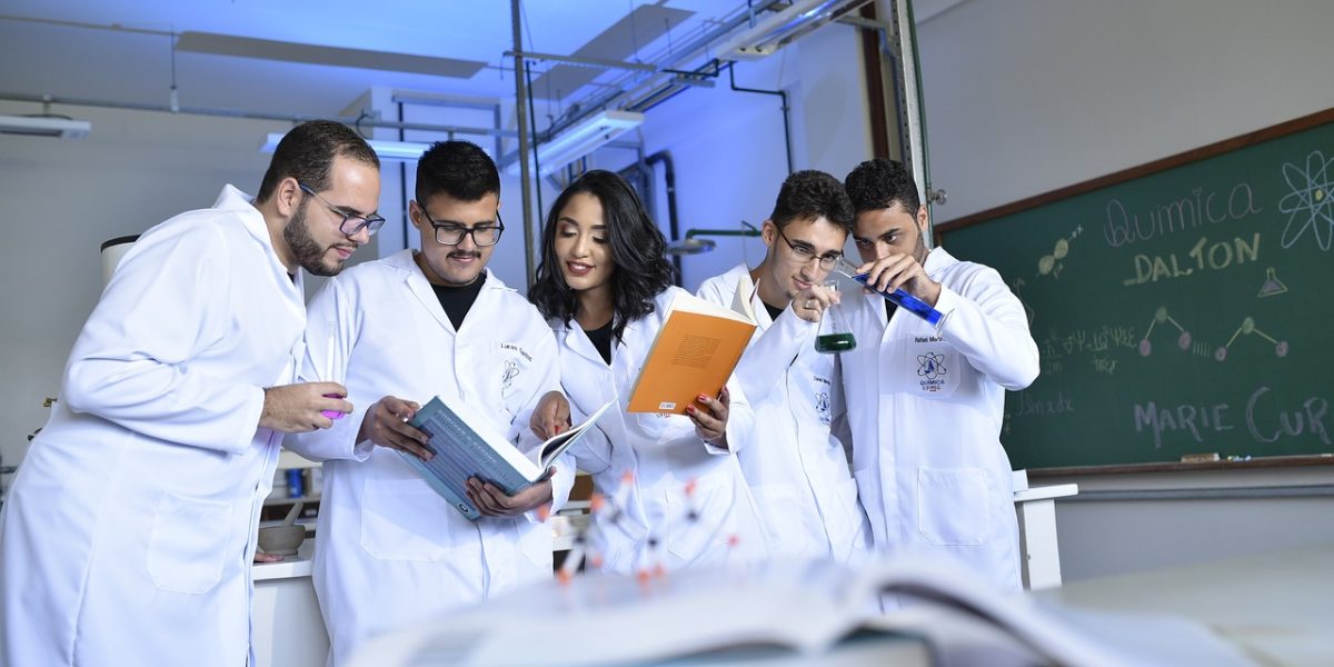 Scientists collaborating in a modern laboratory setting, symbolizing the R&D efforts in biotechnology and drug discovery.