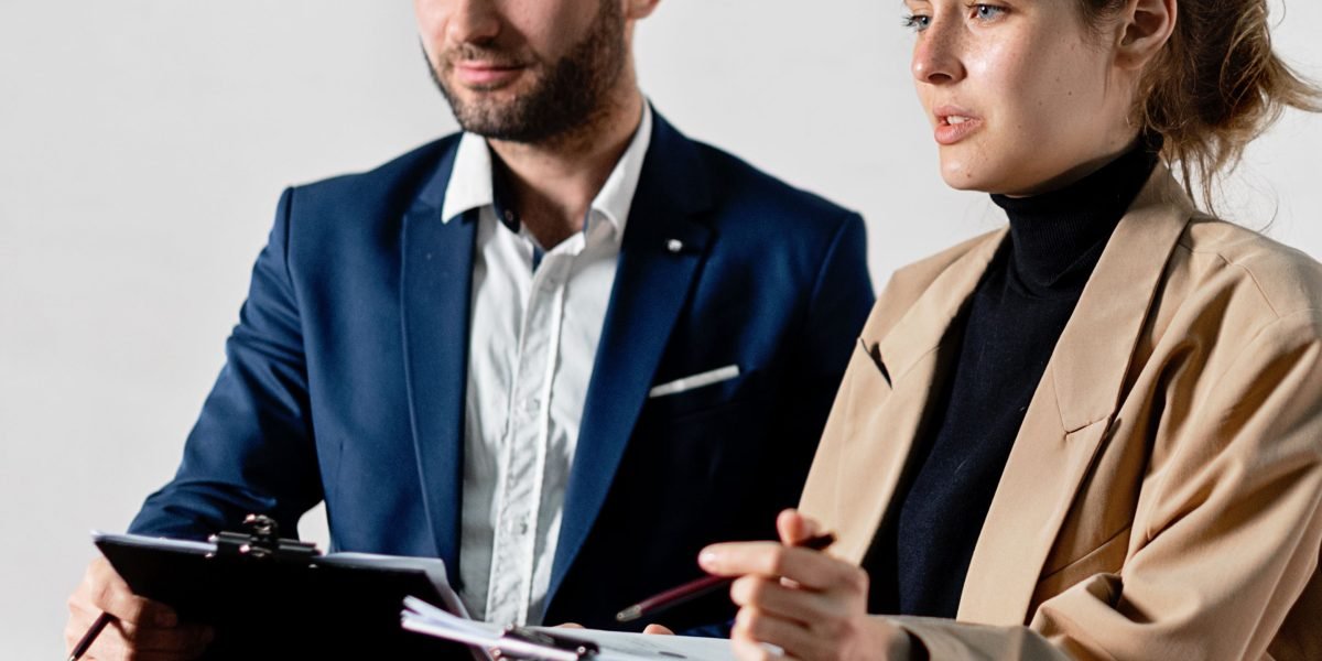 A legal team in a meeting room, intensely discussing compliance issues and potential legal challenges.