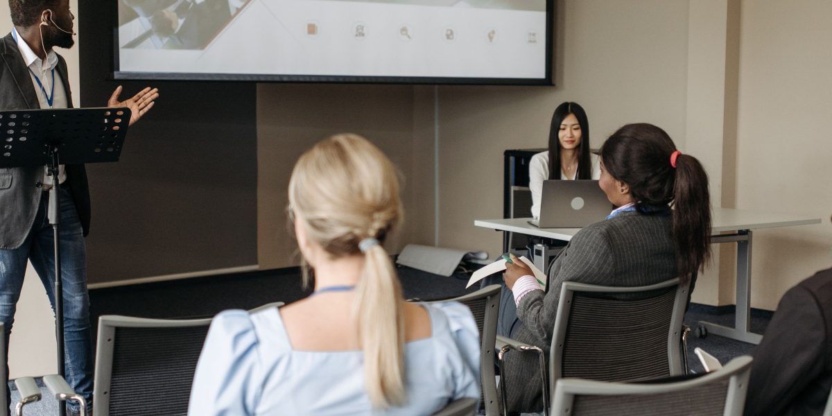 A diverse team engaged in a workshop or training session, developing new skills.